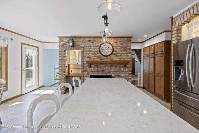 11781 W Herbison Rd, Eagle, MI 48822 - kitchen featuring stainless steel refrigerator with ice dispenser, light stone counters, ornamental molding, baseboards, and decorative light fixtures