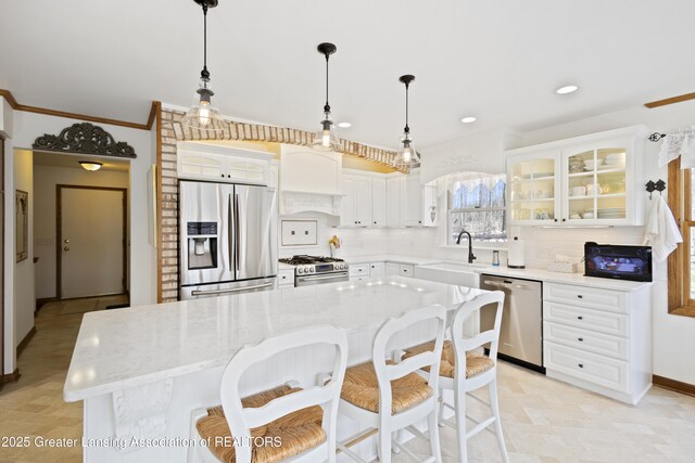 11781 W Herbison Rd, Eagle, MI 48822 - kitchen with appliances with stainless steel finishes, a sink, white cabinetry, decorative backsplash, and recessed lighting