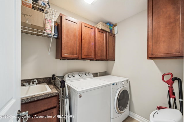 1058 Buckingham Rd, Haslett, MI 48840 - laundry area featuring washer and dryer and cabinet space