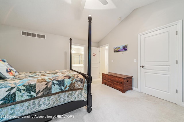 1058 Buckingham Rd, Haslett, MI 48840 - bedroom with vaulted ceiling, light carpet, connected bathroom, a ceiling fan, and baseboards