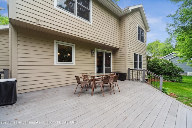 1058 Buckingham Rd, Haslett, MI 48840 - deck featuring outdoor dining area