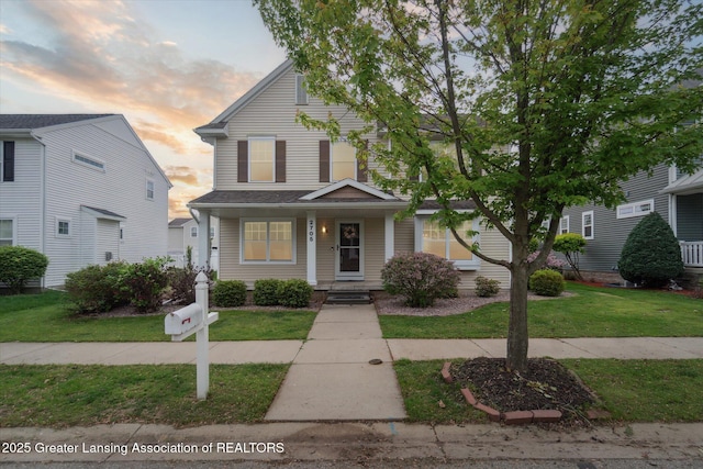 2705 Tapestry Dr Unit 53, Okemos, MI 48864 - view of front of house with a yard and a porch