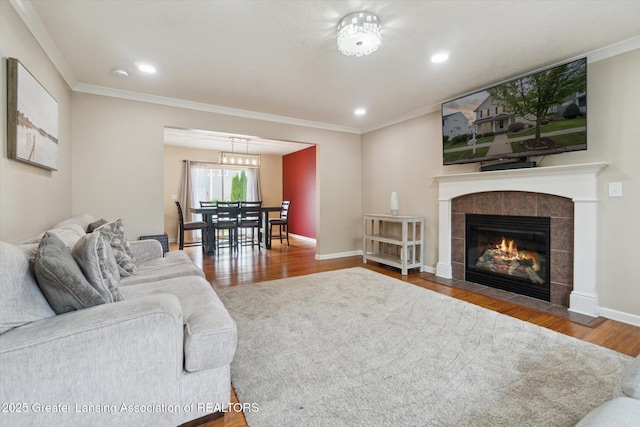 2705 Tapestry Dr Unit 53, Okemos, MI 48864 - living room featuring wood finished floors, ornamental molding, a fireplace, recessed lighting, and baseboards