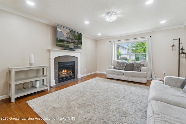2705 Tapestry Dr Unit 53, Okemos, MI 48864 - living room with ornamental molding, a tile fireplace, recessed lighting, wood finished floors, and baseboards