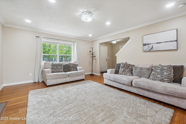 2705 Tapestry Dr Unit 53, Okemos, MI 48864 - living area featuring wood finished floors, baseboards, crown molding, and recessed lighting