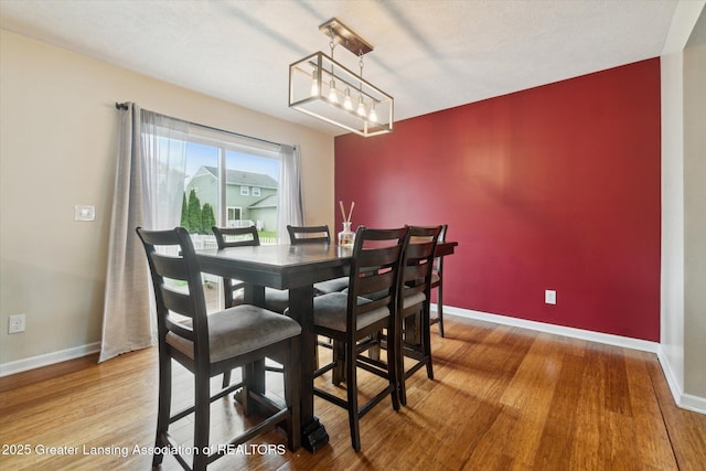2705 Tapestry Dr Unit 53, Okemos, MI 48864 - dining space with baseboards and wood finished floors