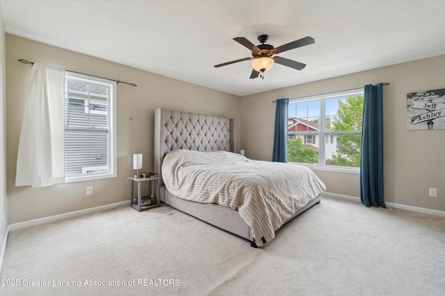 2705 Tapestry Dr Unit 53, Okemos, MI 48864 - bedroom with baseboards, carpet flooring, and a ceiling fan
