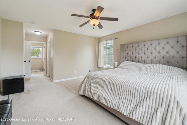 2705 Tapestry Dr Unit 53, Okemos, MI 48864 - bedroom featuring baseboards, carpet floors, and ceiling fan