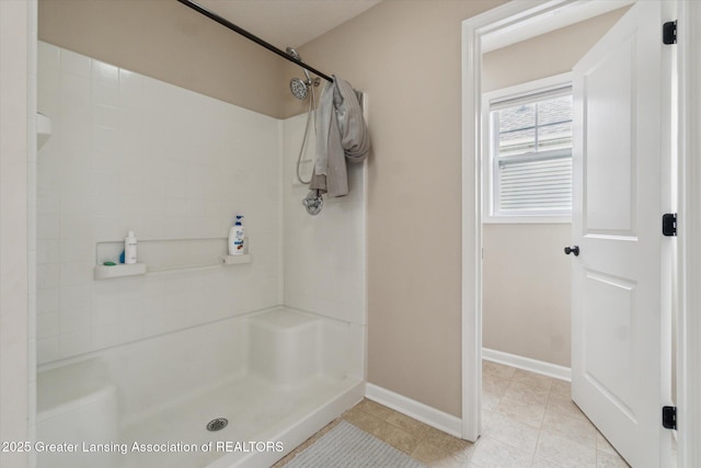 2705 Tapestry Dr Unit 53, Okemos, MI 48864 - bathroom with a shower, baseboards, and tile patterned floors