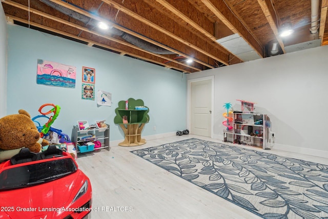 2705 Tapestry Dr Unit 53, Okemos, MI 48864 - rec room featuring wood finished floors and baseboards