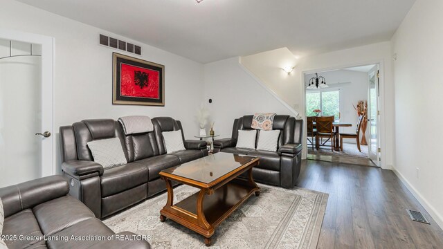 1100 Cranbrook Ln, Mason, MI 48854 - living area featuring wood finished floors and baseboards