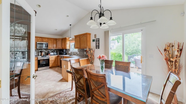 1100 Cranbrook Ln, Mason, MI 48854 - dining space with a chandelier and vaulted ceiling