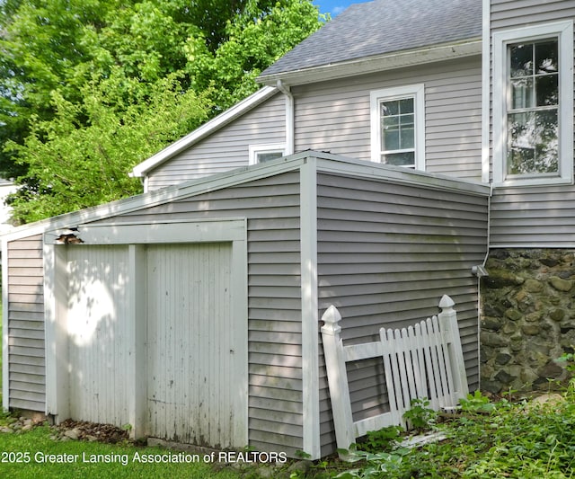 206 W Harris St, Charlotte, MI 48813 - view of home's exterior featuring a shingled roof