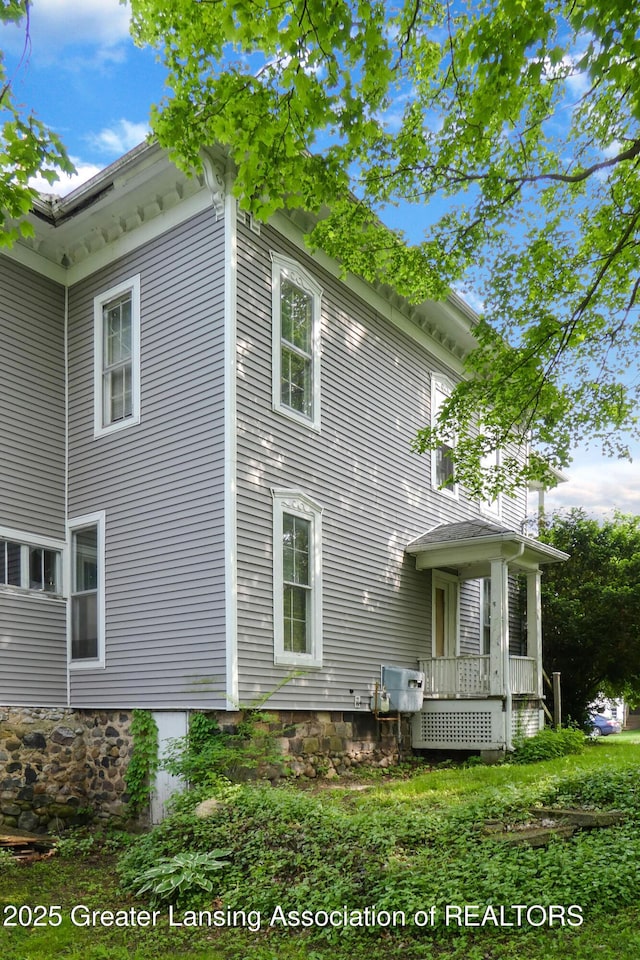 206 W Harris St, Charlotte, MI 48813 - view of side of property featuring a wooden deck