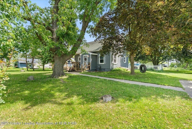 424 N Morrice Rd, Morrice, MI 48857 - view of front of house with a front lawn