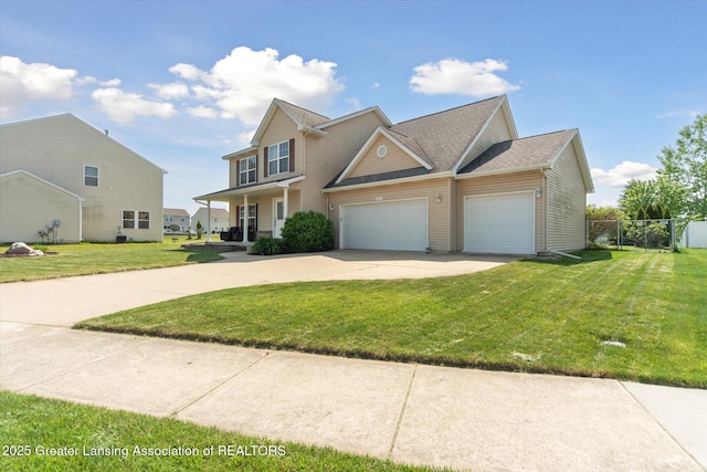 5619 Bittern Dr, Holt, MI 48842 - traditional-style home with concrete driveway and an attached garage