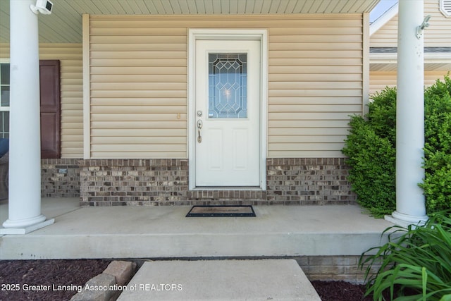 5619 Bittern Dr, Holt, MI 48842 - view of exterior entry featuring covered porch