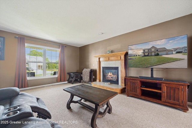 5619 Bittern Dr, Holt, MI 48842 - carpeted living area with a tiled fireplace and baseboards