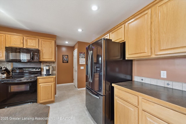 5619 Bittern Dr, Holt, MI 48842 - kitchen featuring black appliances, dark countertops, baseboards, tasteful backsplash, and recessed lighting