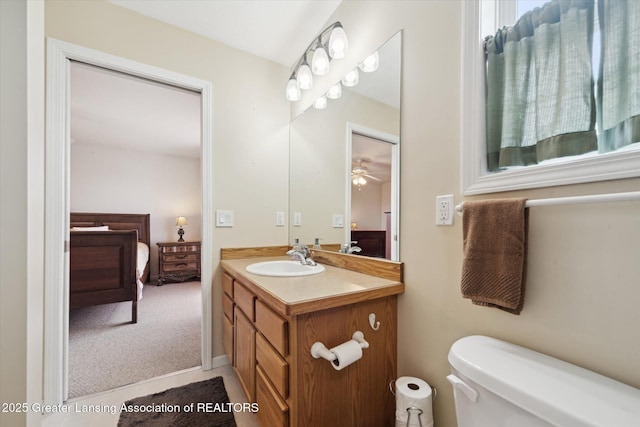 5619 Bittern Dr, Holt, MI 48842 - ensuite bathroom featuring vanity, toilet, and ceiling fan