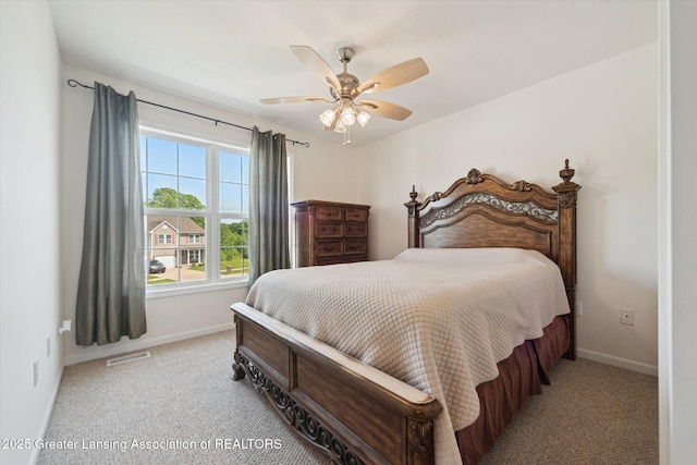 5619 Bittern Dr, Holt, MI 48842 - bedroom featuring light colored carpet, baseboards, and a ceiling fan