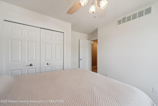 5619 Bittern Dr, Holt, MI 48842 - bedroom featuring a closet and ceiling fan