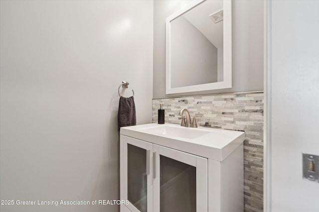 5619 Bittern Dr, Holt, MI 48842 - bathroom featuring vanity and backsplash