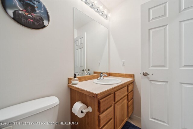 5619 Bittern Dr, Holt, MI 48842 - half bathroom featuring toilet and vanity