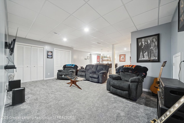 5619 Bittern Dr, Holt, MI 48842 - living room with carpet flooring, a drop ceiling, and baseboards