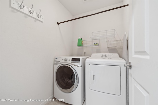 5619 Bittern Dr, Holt, MI 48842 - laundry area featuring washer and dryer