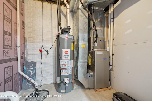5619 Bittern Dr, Holt, MI 48842 - utility room with gas water heater