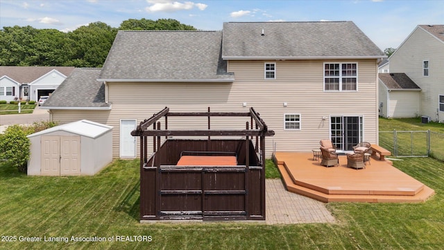 5619 Bittern Dr, Holt, MI 48842 - back of property with a jacuzzi, a wooden deck, roof with shingles, and cooling unit