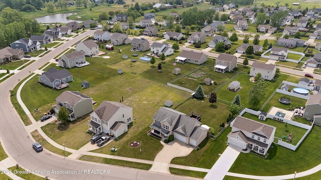 5619 Bittern Dr, Holt, MI 48842 - aerial view of property and surrounding area featuring a large body of water and nearby suburban area