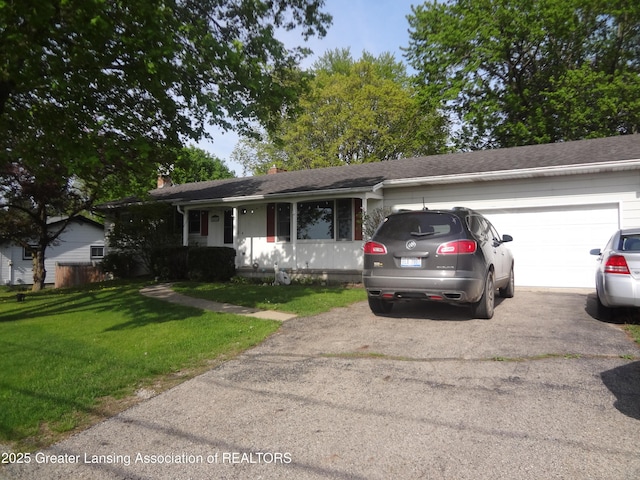 14311 Chandler Rd, Bath, MI 48808 - ranch-style house with driveway, a garage, a front lawn, a chimney, and roof with shingles
