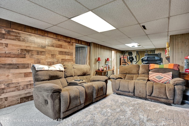 14311 Chandler Rd, Bath, MI 48808 - carpeted living room featuring wooden walls and a paneled ceiling
