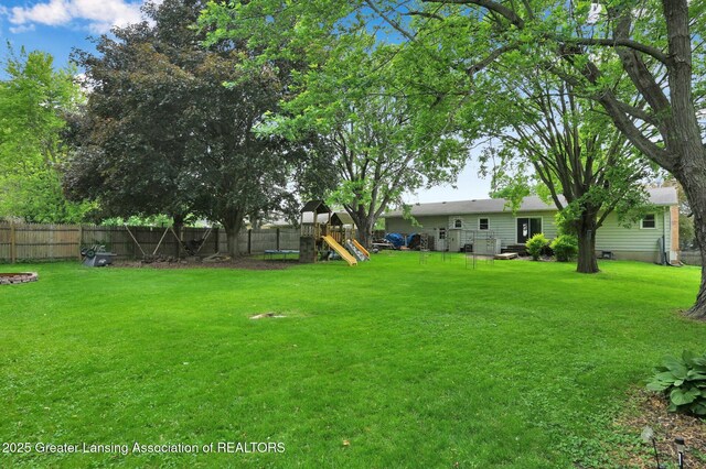 14311 Chandler Rd, Bath, MI 48808 - view of yard with a playground