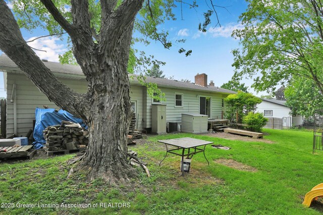 14311 Chandler Rd, Bath, MI 48808 - back of property featuring a chimney