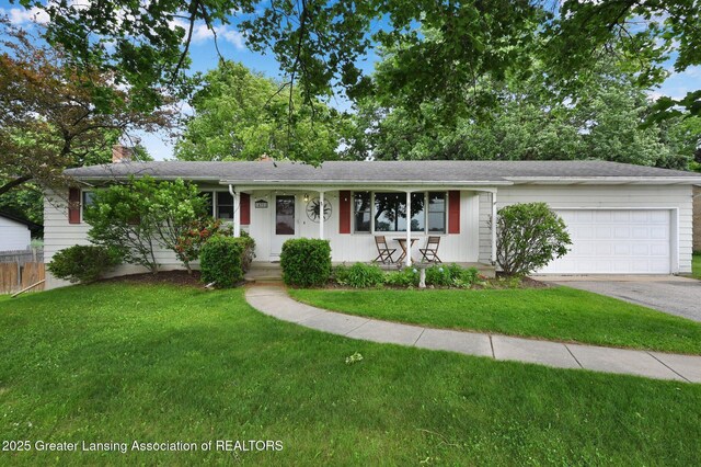 14311 Chandler Rd, Bath, MI 48808 - ranch-style home with driveway, a garage, a chimney, and covered porch