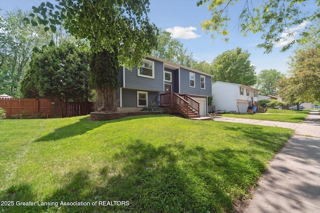 2500 Champion Way, Lansing, MI 48910 - split foyer home with driveway and an attached garage