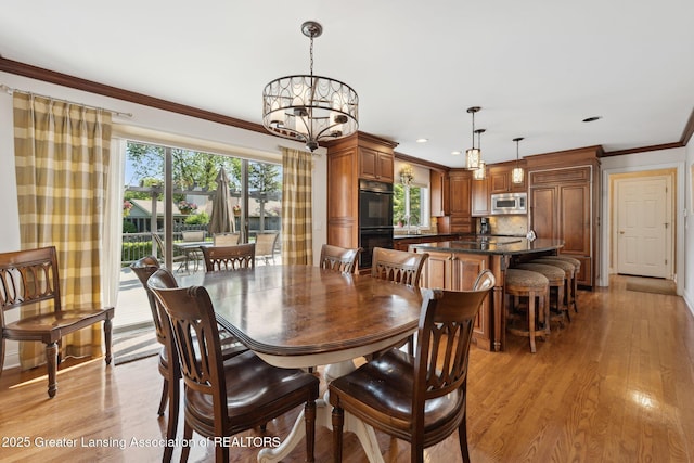 1209 Windale Pl, East Lansing, MI 48823 - dining area featuring a chandelier, ornamental molding, light wood finished floors, and recessed lighting