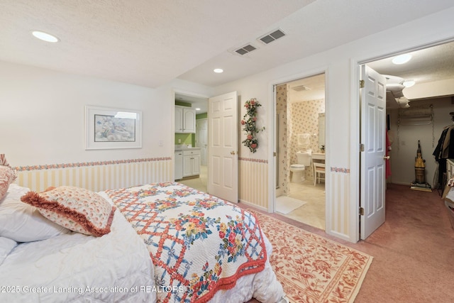 1209 Windale Pl, East Lansing, MI 48823 - bedroom featuring light colored carpet, recessed lighting, connected bathroom, and a spacious closet
