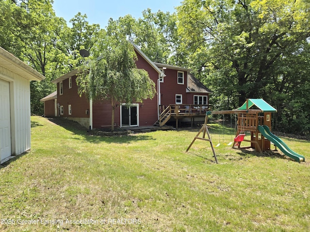 4423 Hyatt St, Eaton Rapids, MI 48827 - view of green lawn featuring a playground and a deck