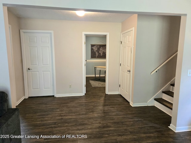 4423 Hyatt St, Eaton Rapids, MI 48827 - interior space featuring dark wood-type flooring, baseboards, and stairway