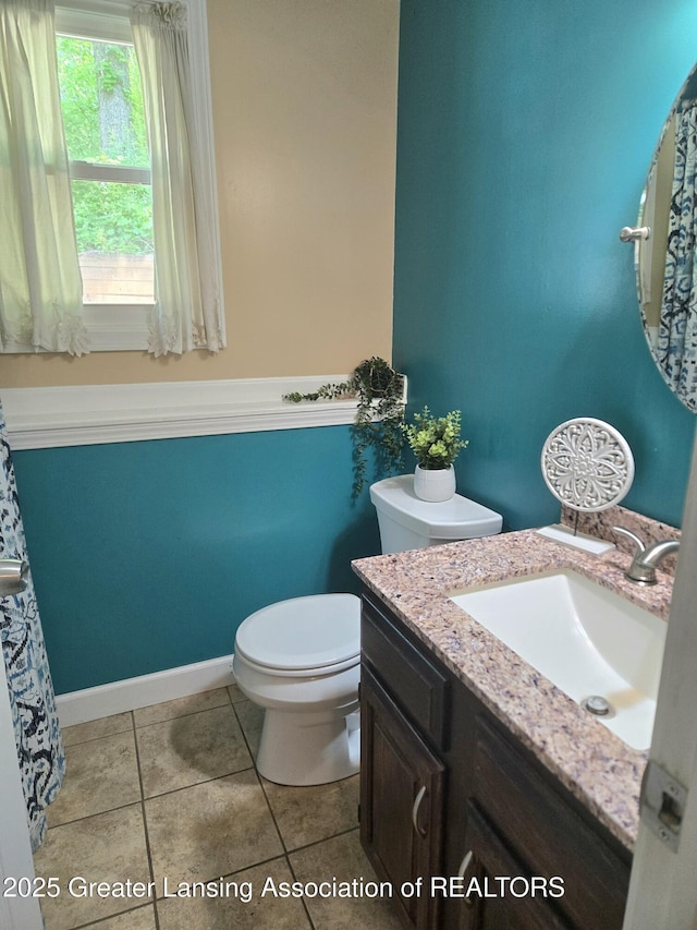 4423 Hyatt St, Eaton Rapids, MI 48827 - full bath featuring vanity, toilet, and tile patterned floors