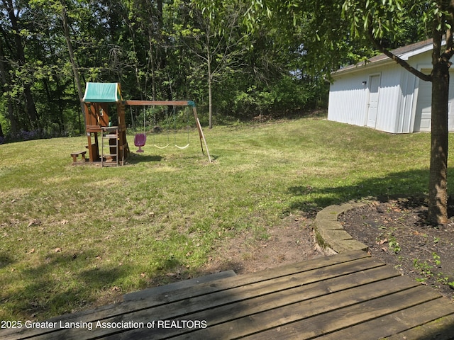 4423 Hyatt St, Eaton Rapids, MI 48827 - view of green lawn featuring a playground
