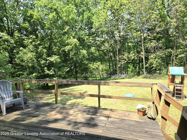 4423 Hyatt St, Eaton Rapids, MI 48827 - wooden deck with a yard and a view of trees