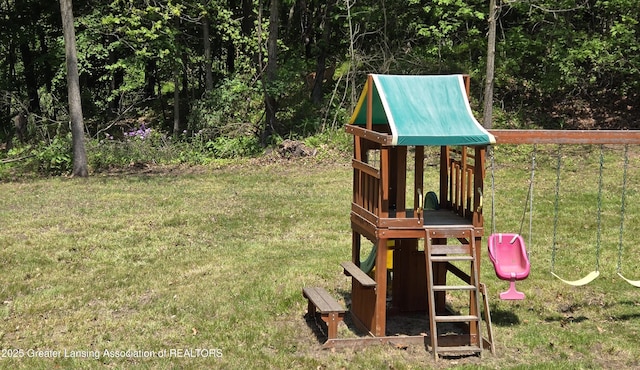 4423 Hyatt St, Eaton Rapids, MI 48827 - view of playground with a yard