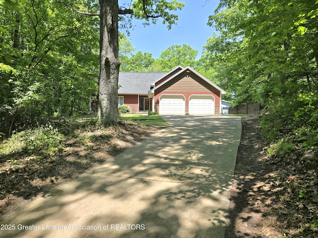 4423 Hyatt St, Eaton Rapids, MI 48827 - view of front of property featuring an attached garage and driveway