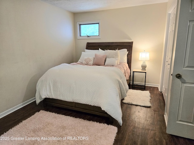 4423 Hyatt St, Eaton Rapids, MI 48827 - bedroom featuring baseboards and wood finished floors