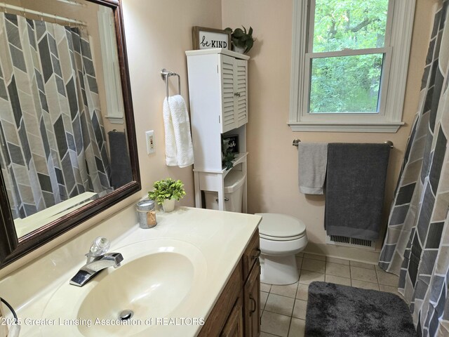 4423 Hyatt St, Eaton Rapids, MI 48827 - bathroom featuring vanity, tile patterned floors, toilet, and curtained shower
